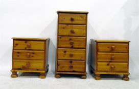 Pair of pine three-drawer bedside chests and a similar pedestal chest of five drawers (3)