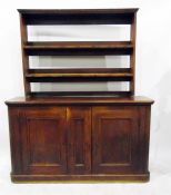 Victorian mahogany storage cupboard with moulded edge top, the three panelled doors below