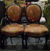 Pair of Victorian cameo-backed standard chairs with floral patterned upholstered backs and seats,