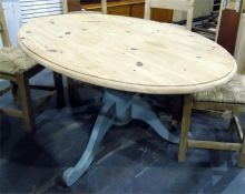 Oval pine kitchen table on painted pedestal and tripod supports