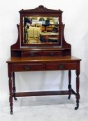 Edwardian mahogany dressing table with pivoted bevelled plate mirror, two short drawers over two
