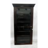 Mahogany bookcase with dentil cornice, the glazed panel door enclosing seven shelves (