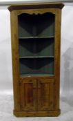 Standing pine corner cupboard, the open upper part with two shaped shelves, over a cupboard enclosed