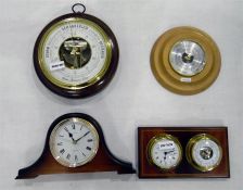Two circular barometers, a barometer/clock combo and a quartz mantel clock (4)