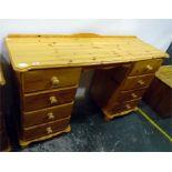 Modern pine twin pedestal dressing table with four short drawers either side of kneehole, raised