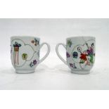 Pair of Japanese teacups decorated with figures entertaining (one damaged) (2)