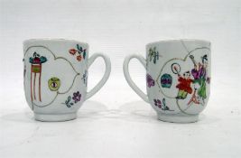 Pair of Japanese teacups decorated with figures entertaining (one damaged) (2)