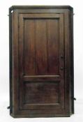 19th century oak corner cupboard, the panelled door enclosing three shelves, height 125cm