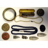 Quantity of costume jewellery to include brooches, buckles, bangles, white buttons, faux-pearls, etc