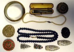 Quantity of costume jewellery to include brooches, buckles, bangles, white buttons, faux-pearls, etc