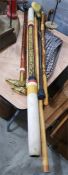 Various modern brass and wood walking sticks, two with horse head handles, a didgeridoo, a