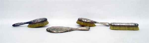 Art Nouveau silver dressing table mirror and brush set depicting woman with flowing hair and