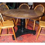 Oak circular-top dining table on turned pedestal support with trefoil platform base, diameter 121cm