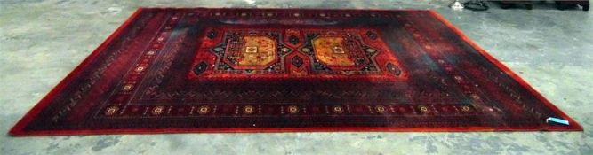 Persian style wool rug with label to reverse 'Antique Royal, 100% Wools of New Zealand', red