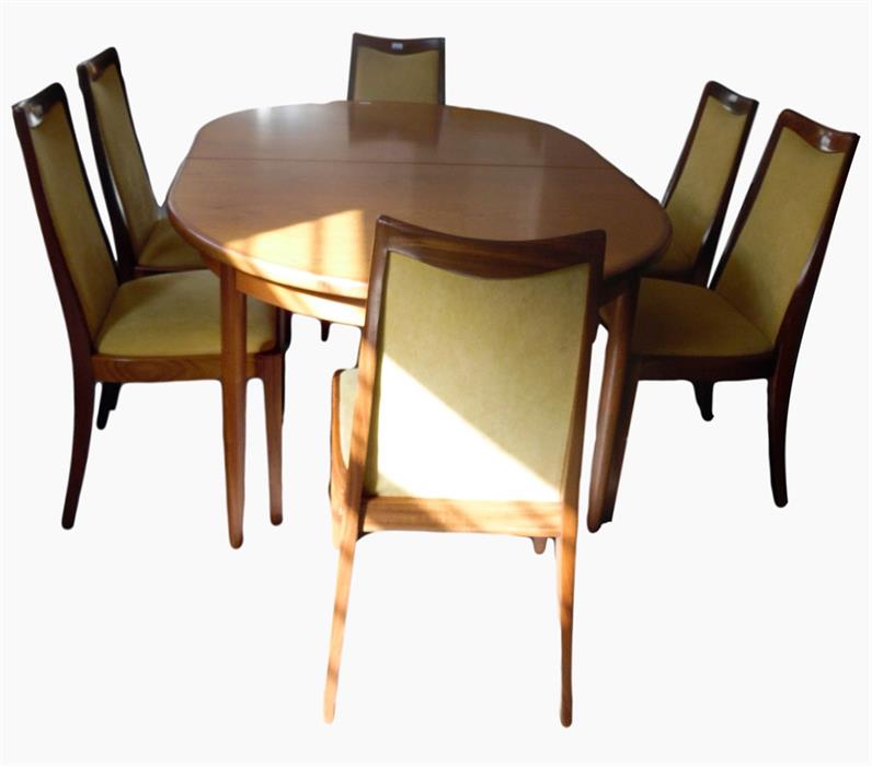 G-Plan extending dining table on turned tapering legs and a set of eight matching dining chairs with