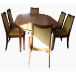 G-Plan extending dining table on turned tapering legs and a set of eight matching dining chairs with