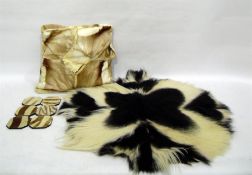 Colobus monkey skin rug, six zebra coasters and an impala skin cushion (1 box)