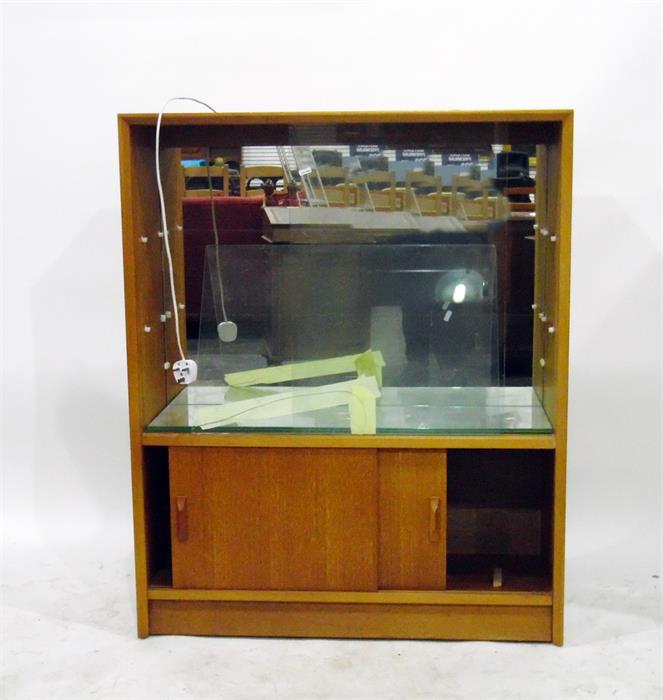 Mid 20th century display cabinet enclosed by glass sliding doors over two sliding cupboard doors