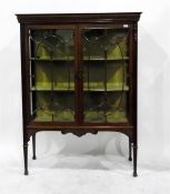 Georgian style mahogany display cabinet with carved fleur-de-lys frieze, oval mirror with iron