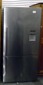 Large fridge freezer by Fisher & Paykel with stainless steel doors, ice maker, freezer below,