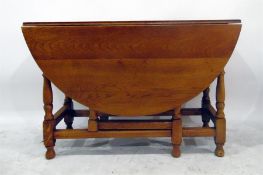 20th century oak oval fall-flap gateleg table on baluster turned supports, 114cm wide