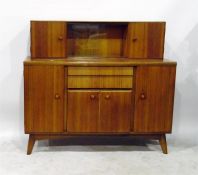 Mid 20th century sideboard, the superstructure with pair of glass sliding doors flanked by cabinets,