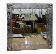 Modern silver-coloured metal framed wall mirror with studded decoration, 70cm wide
