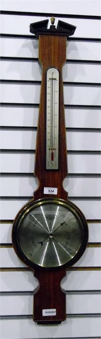 Modern barometer made by Comitti of London, with temperature, within a veneered frame with a