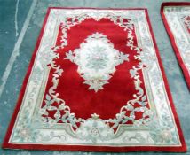 Chinese style wool rug, red ground with floral decoration, 236cm x 150cm and another similar (2)