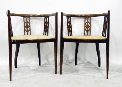 Pair of Edwardian line inlaid mahogany tub chairs with fret carved splats, on square tapering