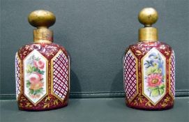 Matched pair Bohemian glass scent bottles with gilt-coloured lids and floral decoration, 13.5cm high