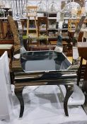 Two modern square glass top coffee tables raised o