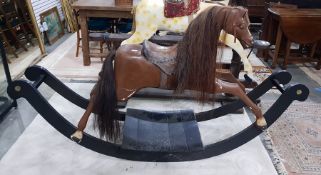 Vintage carved wood child's rocking horse with horse hair mane and tail, brown leather saddle, rais