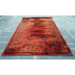 Persian style wool rug, red ground with striped bo