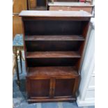 Oak shelving unit with three shelves above two cup