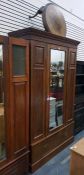 Edwardian walnut wardrobe, the mirrored door flank