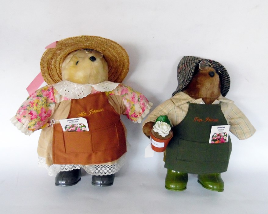 Pair of Johnson Seeds collectors bears in gardenin