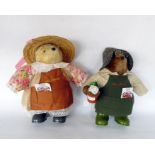 Pair of Johnson Seeds collectors bears in gardenin