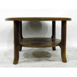 Circular oak segmented table on shaped supports wi