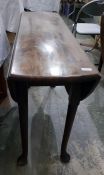 19th century mahogany swing leg table on turned su