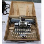 Blick aluminium featherweight typewriter within an