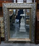 Rectangular bevelled plate wall mirror within an e