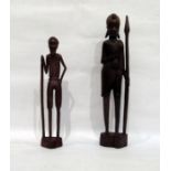 Two carved hardwood African figures holding spears
