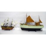Wooden model of a fishing boat and a model of HMS
