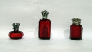 Three 19th Century ruby glass dressing table bottl