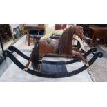 19th century carved wood child's rocking horse with horse hair mane and tail, brown leather