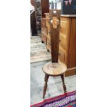 Welsh oak spinning chair with circular seat, on tu