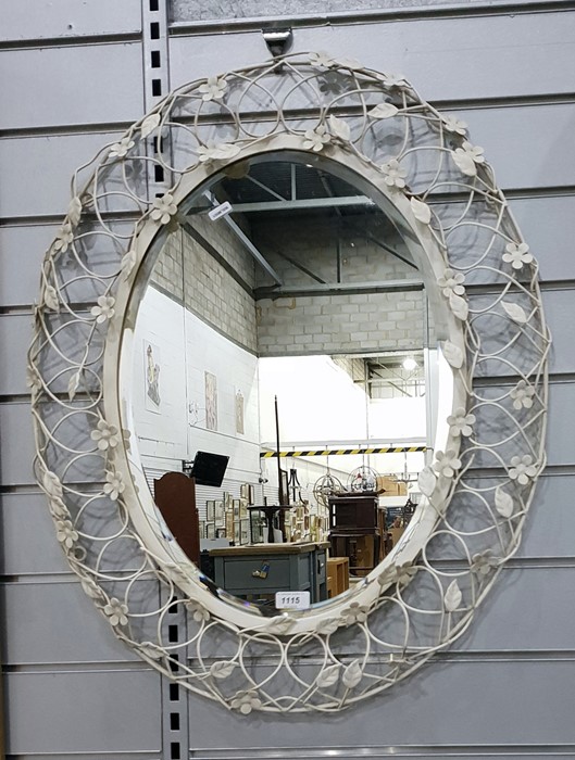 Oval bevelled plate wall mirror within a decorativ