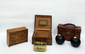 Bowling balls in leather case, miniature straw wor