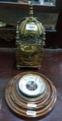 Reproduction brass lantern clock on ball feet and